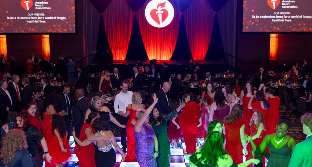 Large group of people celebrating on the dance floor.